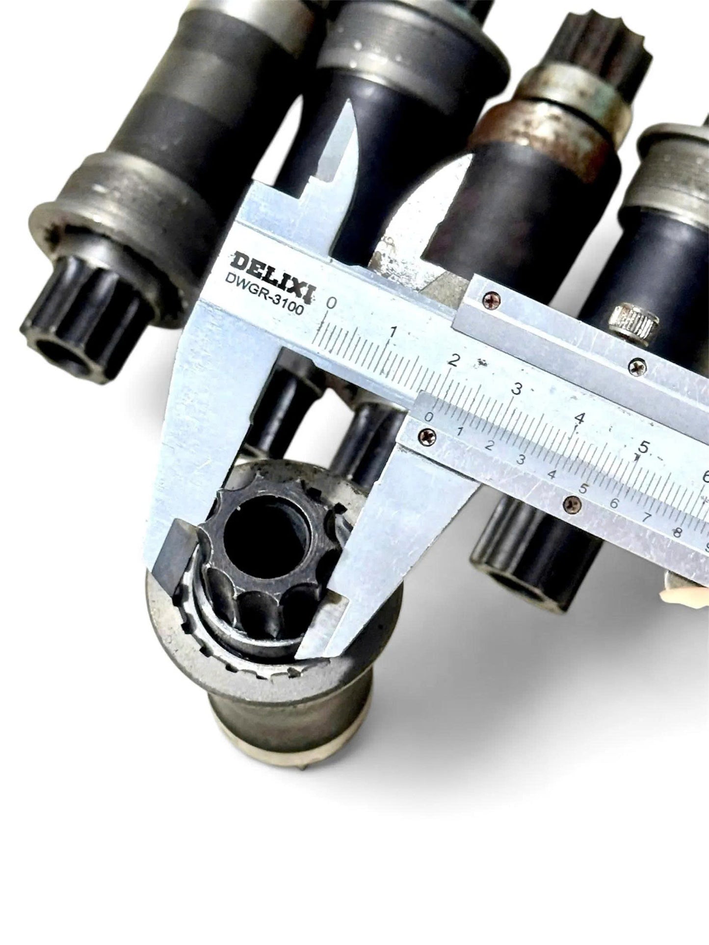 10-Spline Black Bottom Bracket Axle (Rusted, But Smooth Bearings) - 108/113/118mm