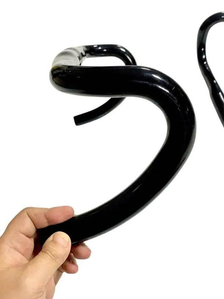 Used full carbon road bike handlebars (take-off). Slight glue residue, easily removable